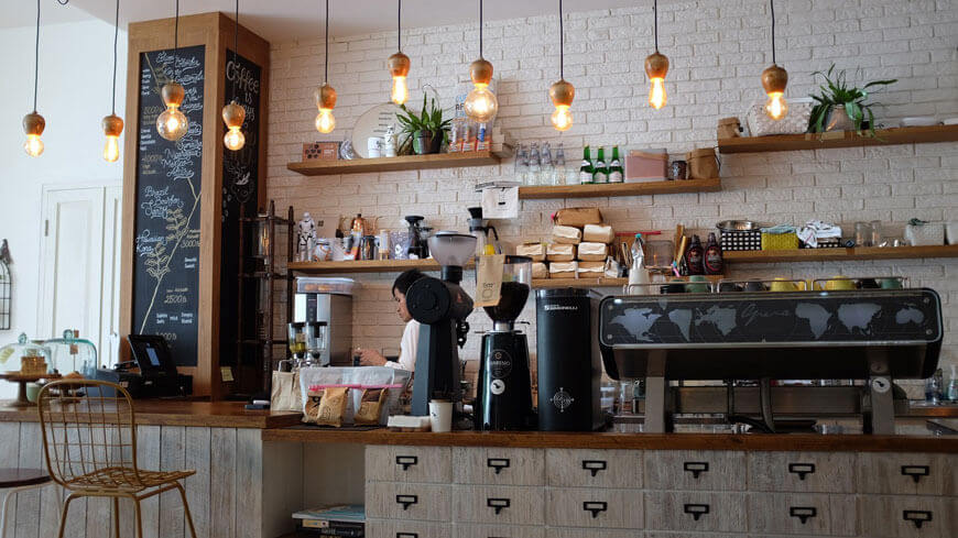 A barista behind the counter in a kava bar