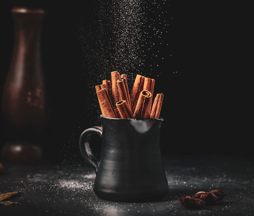 Cinnamon sticks in a black pitcher as an example of natural remedies for seasonal allergies