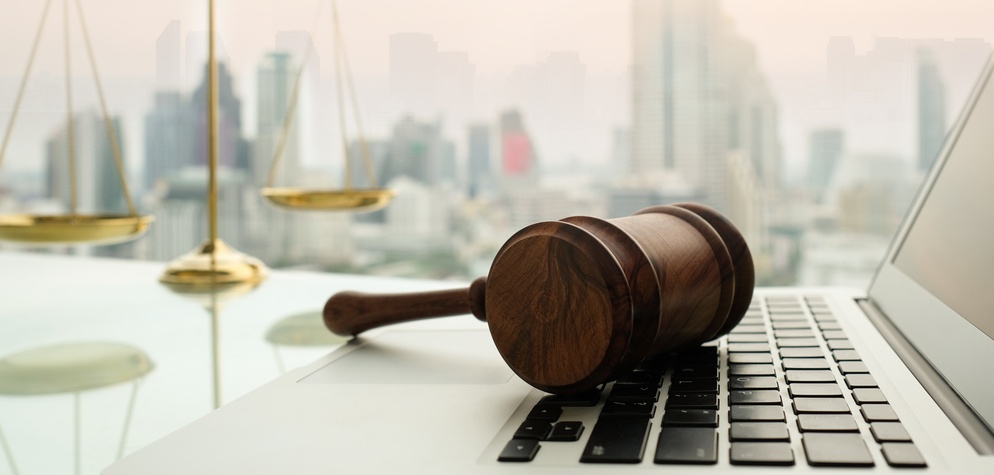 A Court Gauntlet on a Laptop and Desk