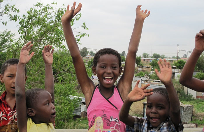 South African children cheering.