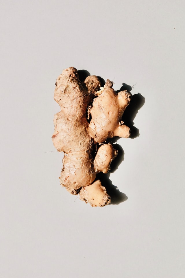 Ginger root against a light grey background