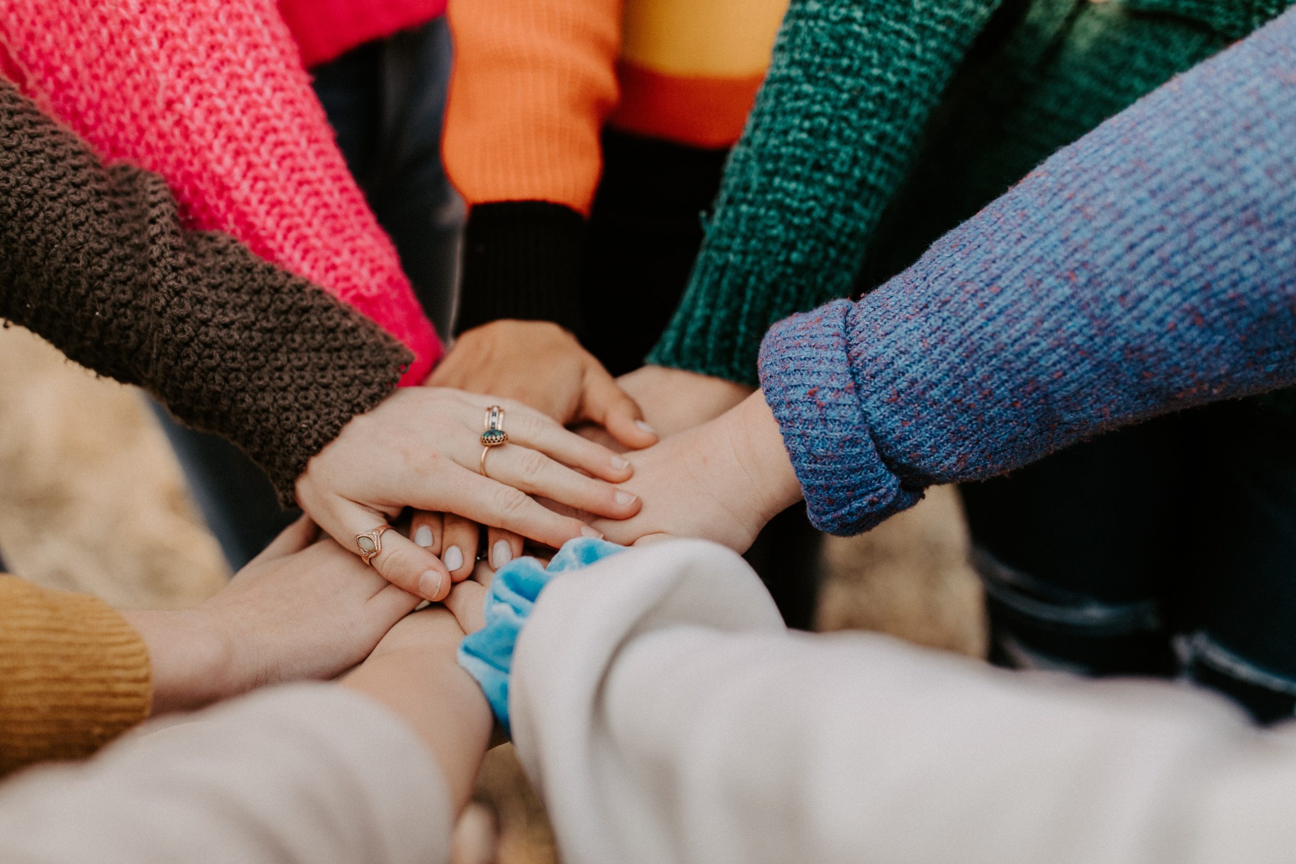 hands piled together