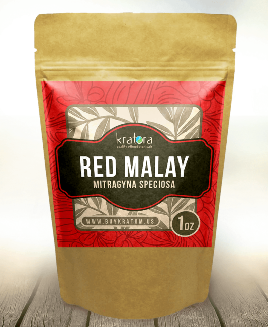 Packet of Red Malay kratom on a wood table 