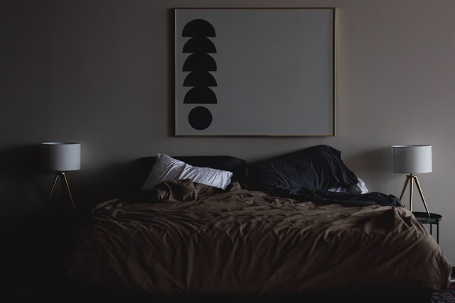 Dark, serene-looking bedroom