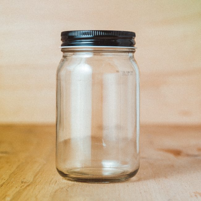 empty storage jar with black lid